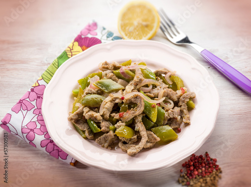 Photo: meat stew with capsicum red pepper and cilantro, selective focus meat stew with capsicum red pepper and cilantro, selective focus