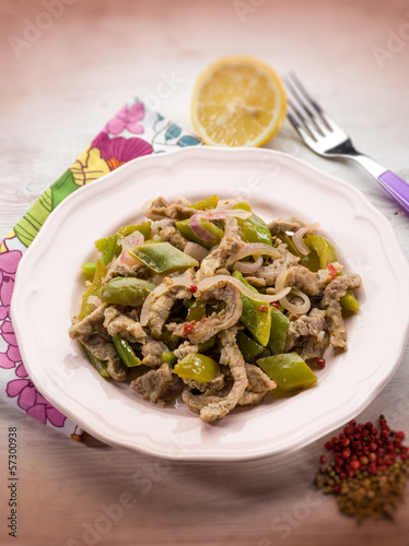 Photo: meat stew with capsicum red pepper and cilantro, selective focus meat stew with capsicum red pepper and cilantro, selective focus