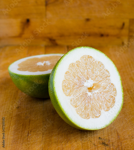 Photo: White grapefruit on wooden background White grapefruit on wooden background