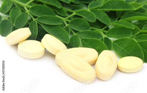 Photo: Edible moringa leaves with pills Edible moringa leaves with pills
