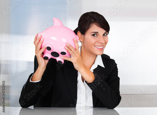 Photo: Businesswoman With Piggy Bank Businesswoman With Piggy Bank