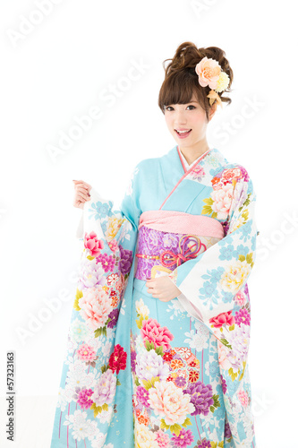 Photo: Beautiful asian kimono woman on white background Beautiful asian kimono woman on white background
