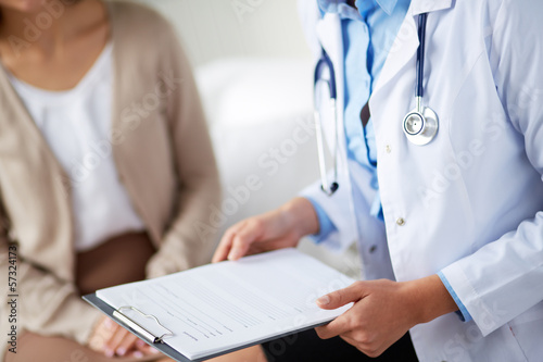 Photo: Doctor with medical card Doctor with medical card