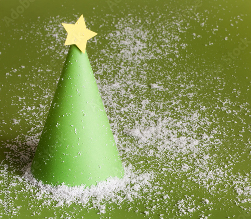 Photo: Christmas abstract paper tree on green background Christmas abstract paper tree on green background