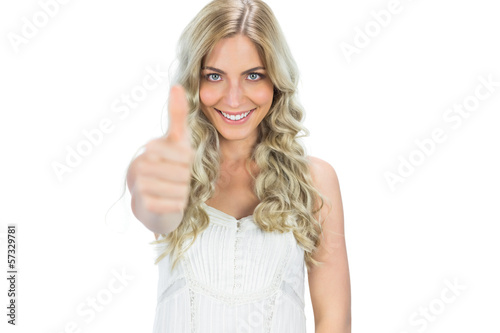Photo: Cheerful seductive model in white dress thumb up Cheerful seductive model in white dress thumb up