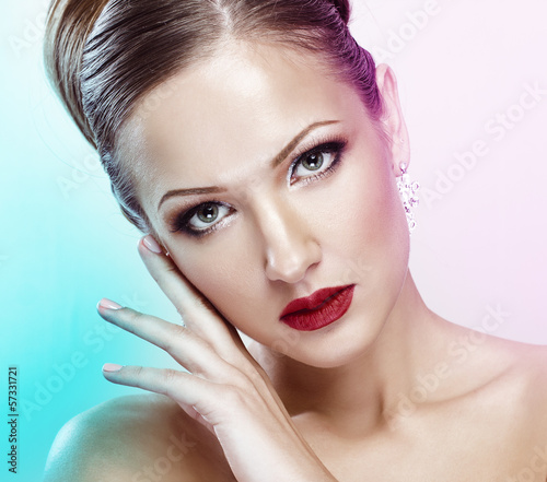 Photo: Close up portrait of beautiful young woman face Close up portrait of beautiful young woman face