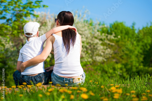 Photo: mother and son are resting in the park. picnic mother and son are resting in the park. picnic