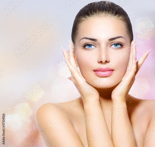 Photo: Beauty Portrait. Beautiful Spa Woman Touching her Face Beauty Portrait. Beautiful Spa Woman Touching her Face