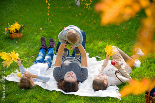 Photo: family having picnic family having picnic