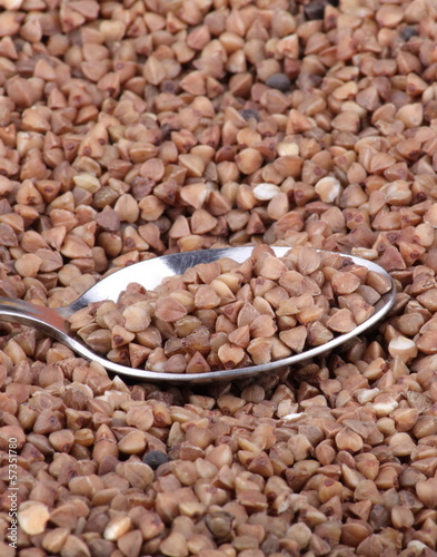 Photo: buckwheat background and teaspoon buckwheat background and teaspoon