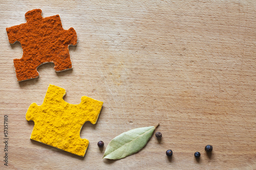 Photo: Food ingredients spices and puzzle diet background concept Food ingredients spices and puzzle diet background concept