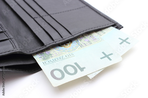 Photo: Closeup of money in wallet on white background Closeup of money in wallet on white background