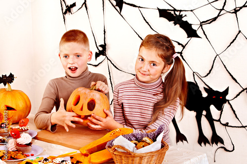 Photo: Halloween party with children holding trick or treat. Halloween party with children holding trick or treat.