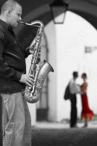 Photo: Saxophone Player With Romantic Couple Saxophone Player With Romantic Couple