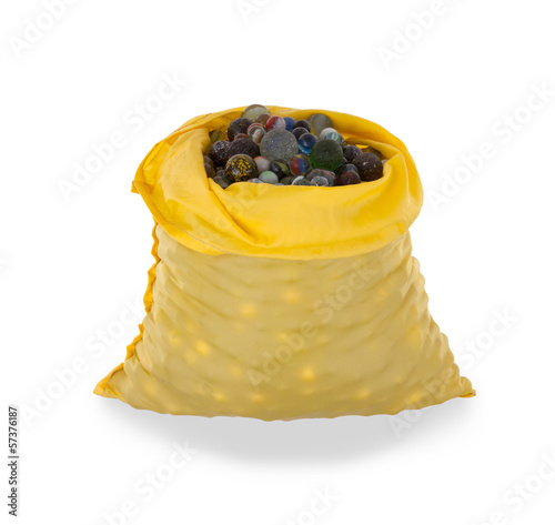 Photo: Assorted black glass marbles arranged in a yellow pouch Assorted black glass marbles arranged in a yellow pouch