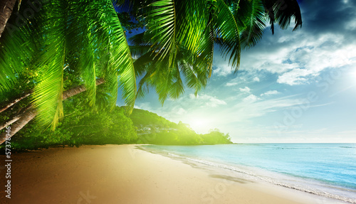 Photo: sunset on beach Anse Takamaka of Mahe island, seychelles sunset on beach Anse Takamaka of Mahe island, seychelles