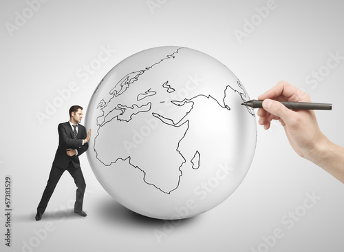 Photo: businessman pushing ball businessman pushing ball