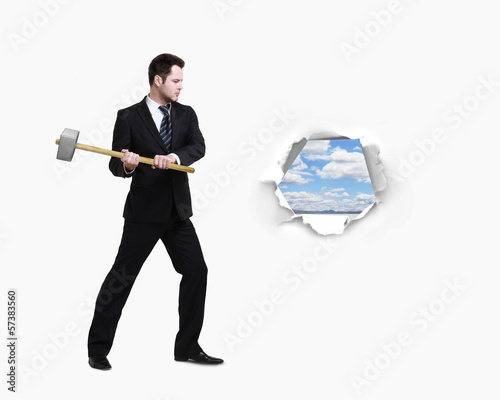 Photo: businessman with a hammer businessman with a hammer