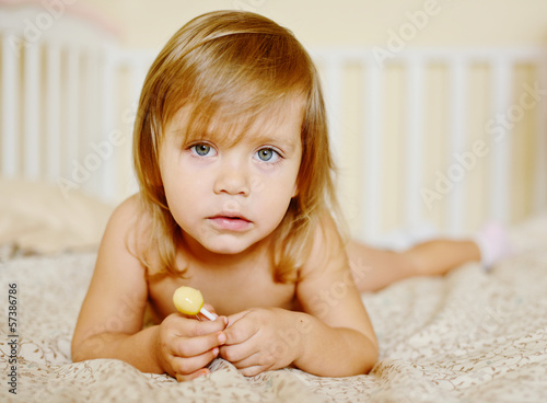 Photo: toddler with lollipop toddler with lollipop