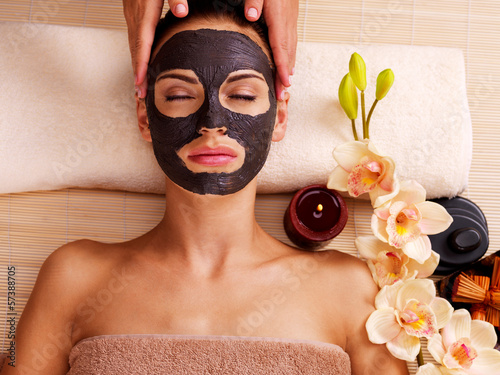 Photo: Cosmetologist doing massage on the woman's face in sap salon Cosmetologist doing massage on the woman's face in sap salon