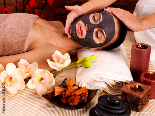 Photo: Cosmetologist doing massage on the woman's face in sap salon Cosmetologist doing massage on the woman's face in sap salon