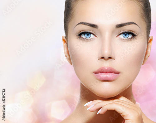 Photo: Beauty Portrait. Beautiful Spa Woman Touching her Face Beauty Portrait. Beautiful Spa Woman Touching her Face