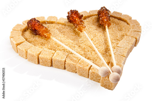 Photo: Heart from not refined reed sugar and candy sugar on a stick.. Heart from not refined reed sugar and candy sugar on a stick..