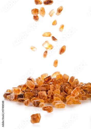 Photo: Slices of falling brown candy sugar .. Slices of falling brown candy sugar ..