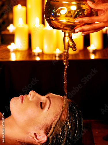 Photo: Woman having Ayurvedic spa treatment. Woman having Ayurvedic spa treatment.