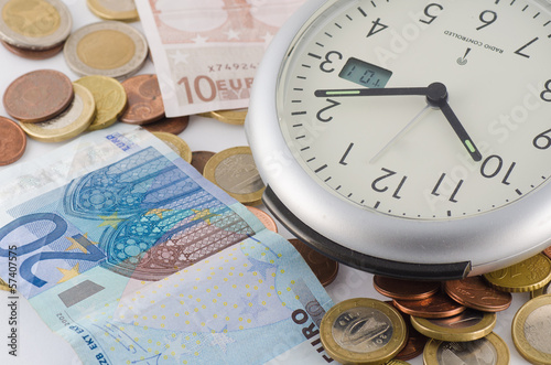 Photo: time is money with standing clock and euro's time is money with standing clock and euro's