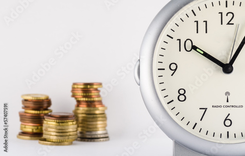 Photo: time is money with standing clock and euro's time is money with standing clock and euro's