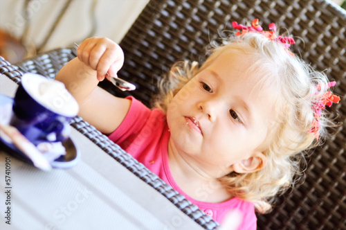 Photo: toddler girl in cafe toddler girl in cafe