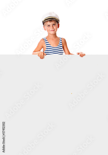 Photo: Boy holding a banner Boy holding a banner
