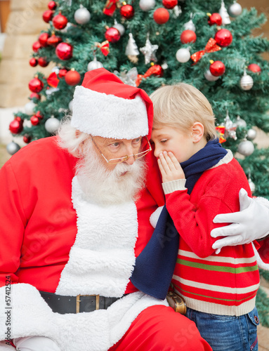 Photo: Boy Telling Wish In Santa Claus's Ear Boy Telling Wish In Santa Claus's Ear