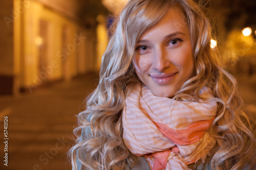 Photo: young female businesswoman in night city. young female businesswoman in night city.