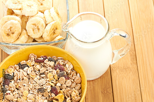 Photo: Delicious and healthy cereal in bowl with milk Delicious and healthy cereal in bowl with milk