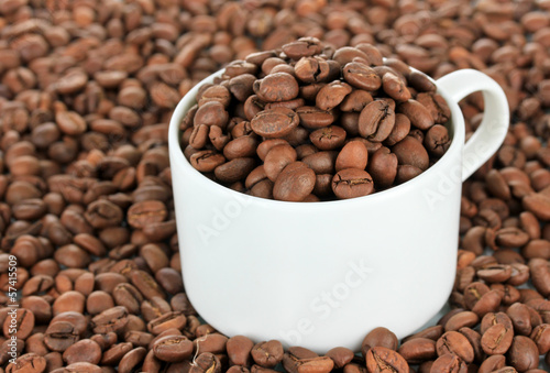 Photo: Coffee beans in cup close-up Coffee beans in cup close-up