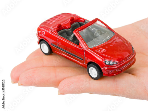 Photo: Hand and toy car Hand and toy car