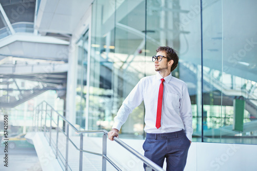 Photo: businessman in office center building businessman in office center building