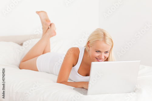 Photo: Beautiful woman using a laptop Beautiful woman using a laptop