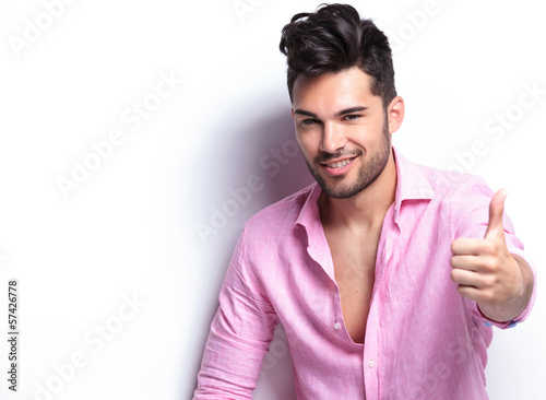 Photo: young fashion man shows thumb up young fashion man shows thumb up