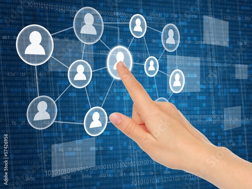 Photo: Hand pushing virtual social media icon close-up. Hand pushing virtual social media icon close-up.