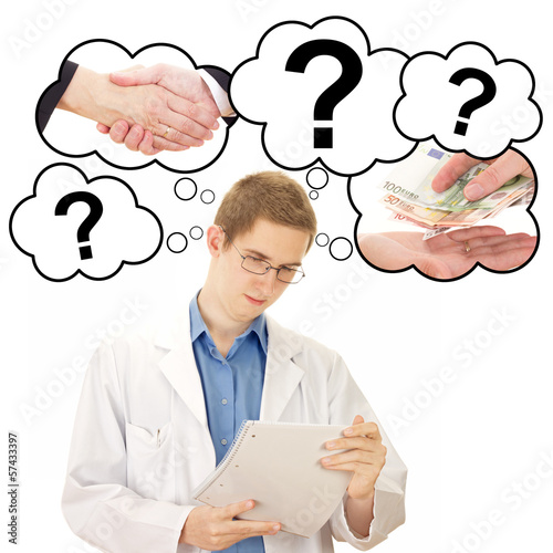 Photo: Young man thinking about his job as medical doctor Young man thinking about his job as medical doctor