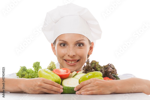 Photo: woman chef or cook and vegetables woman chef or cook and vegetables