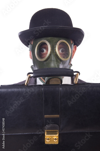 Photo: Businessman wearing gas mask isolated on white Businessman wearing gas mask isolated on white