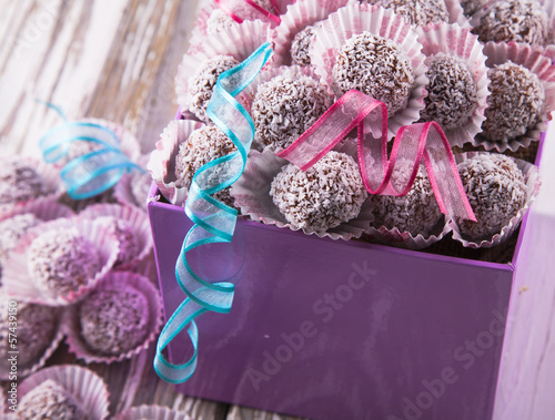 Photo: Sweet chocolate balls on wood Sweet chocolate balls on wood