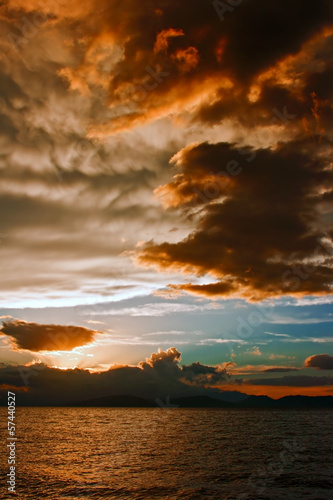 Photo: Mammatus clouds at sunset ahead of violent thunderstorm Mammatus clouds at sunset ahead of violent thunderstorm