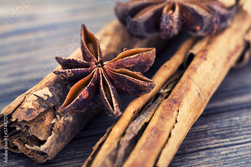 Photo: Star anise and cinnamon on a wooden background Star anise and cinnamon on a wooden background