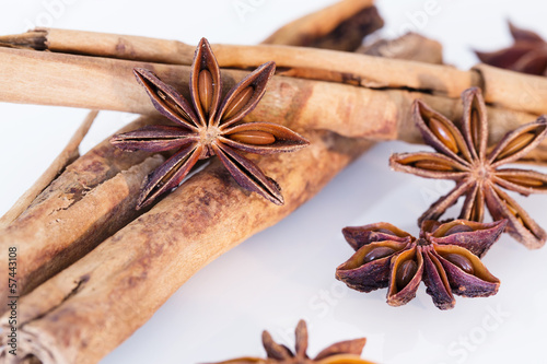 Photo: Star anise and cinnamon on a white background Star anise and cinnamon on a white background