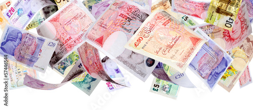 Photo: Panoramic image of falling Pound banknotes isolated on white Panoramic image of falling Pound banknotes isolated on white